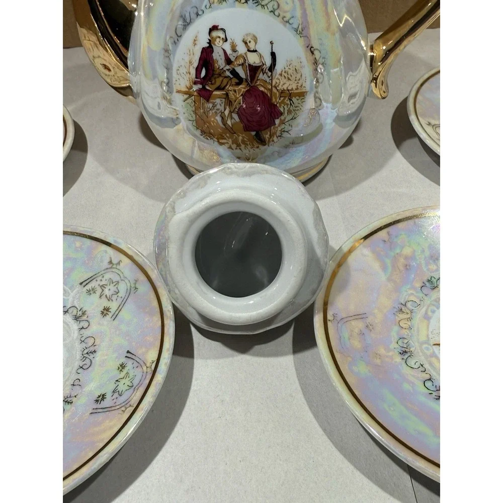 Romeo And Juliet Tea Pot 4 Tea Cups 4 Saucers Gold Trim Handles Iridescent White